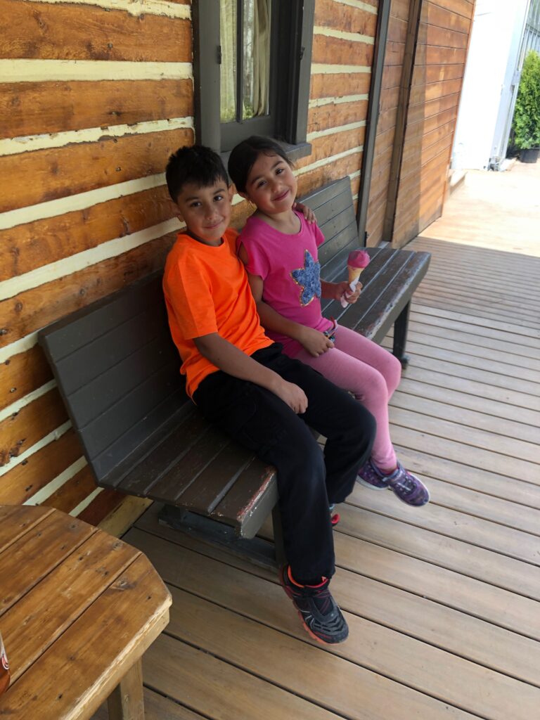 Children eating ice cream in Fish Creek Provincial Park in Calgary.