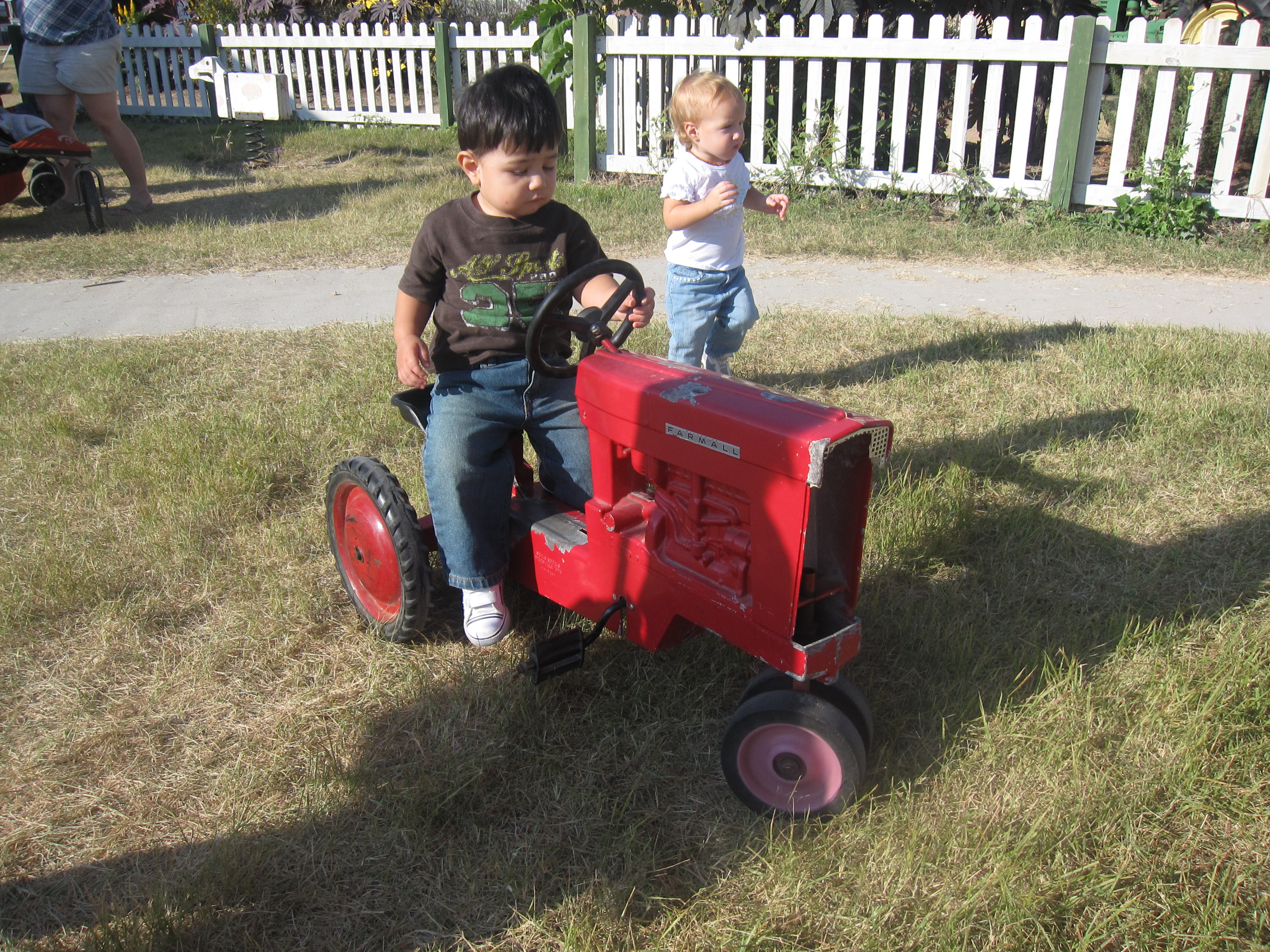 Child on miniature tractor at Dewberry Farms.