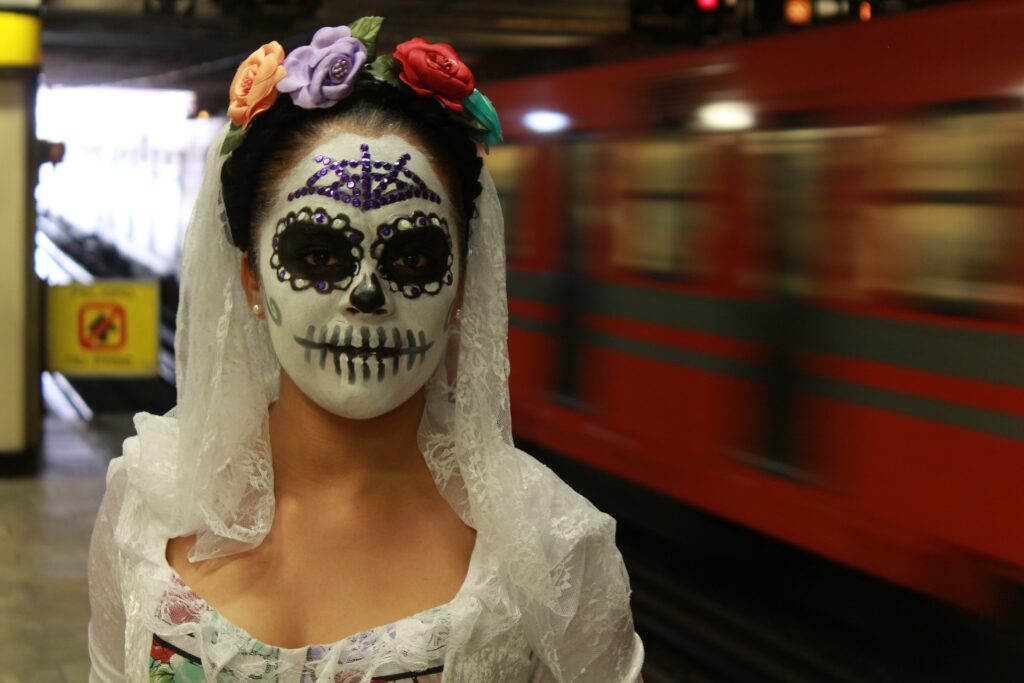 Woman is a Day of the Dead costume in Mexico.