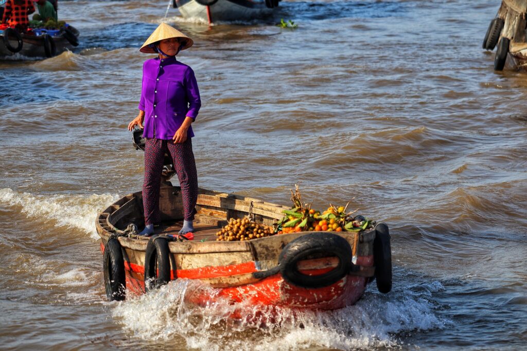 Woman boating on the Mekong Delta in Vietnam.