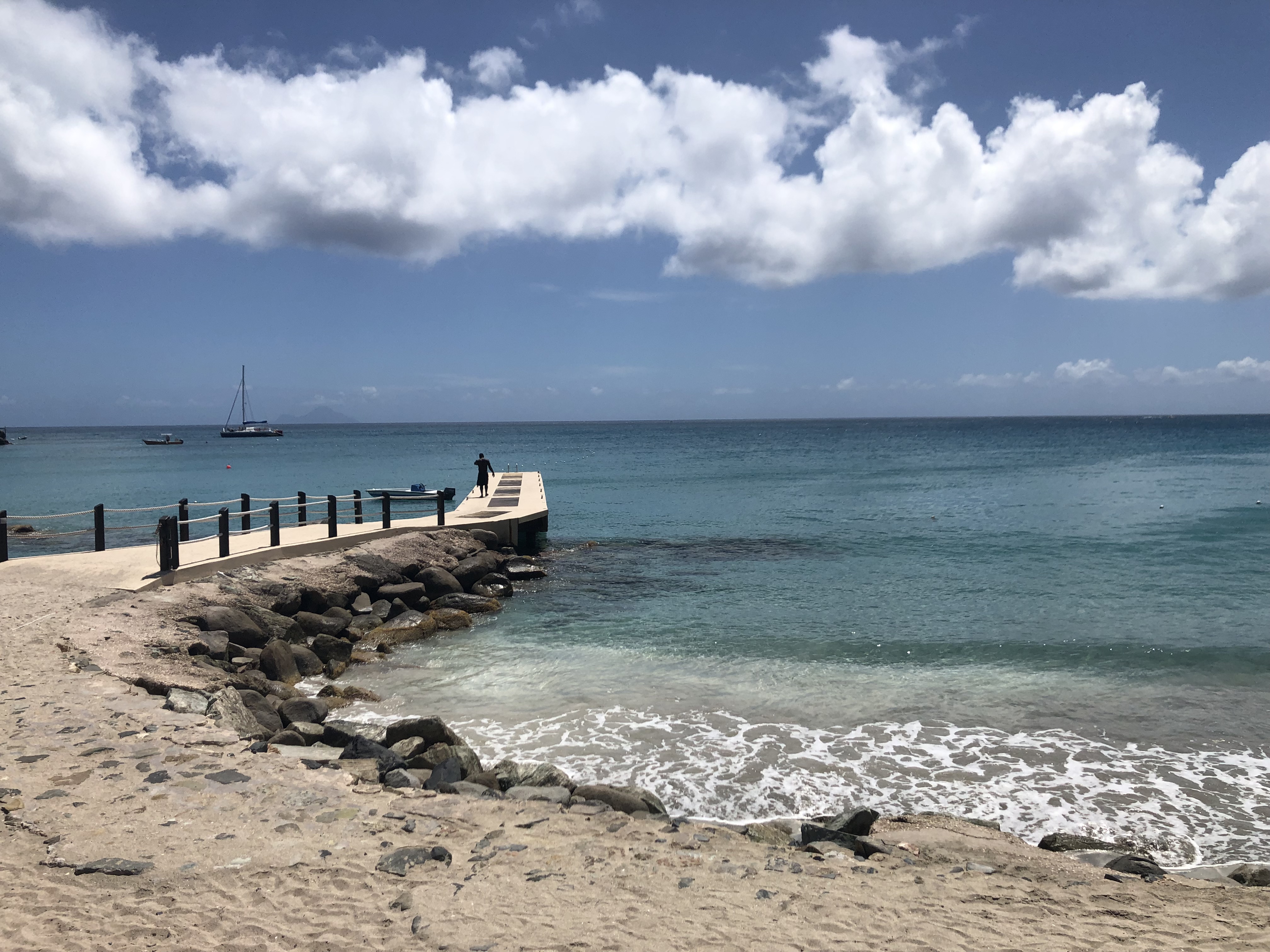 Dock overlooking Caribbean sea.