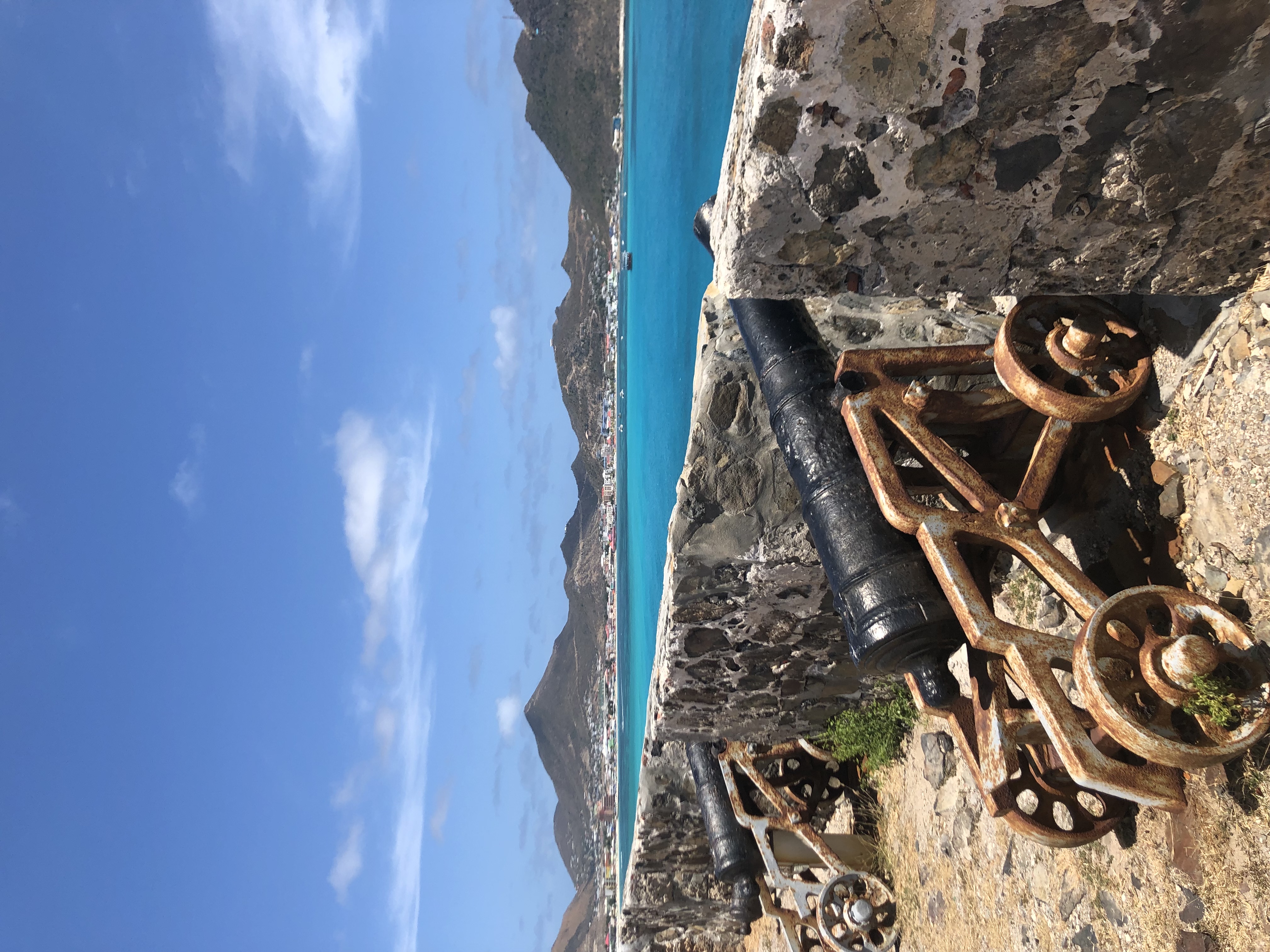 Ancient canon set in wall overlooking Great Bay in St. Maarten.