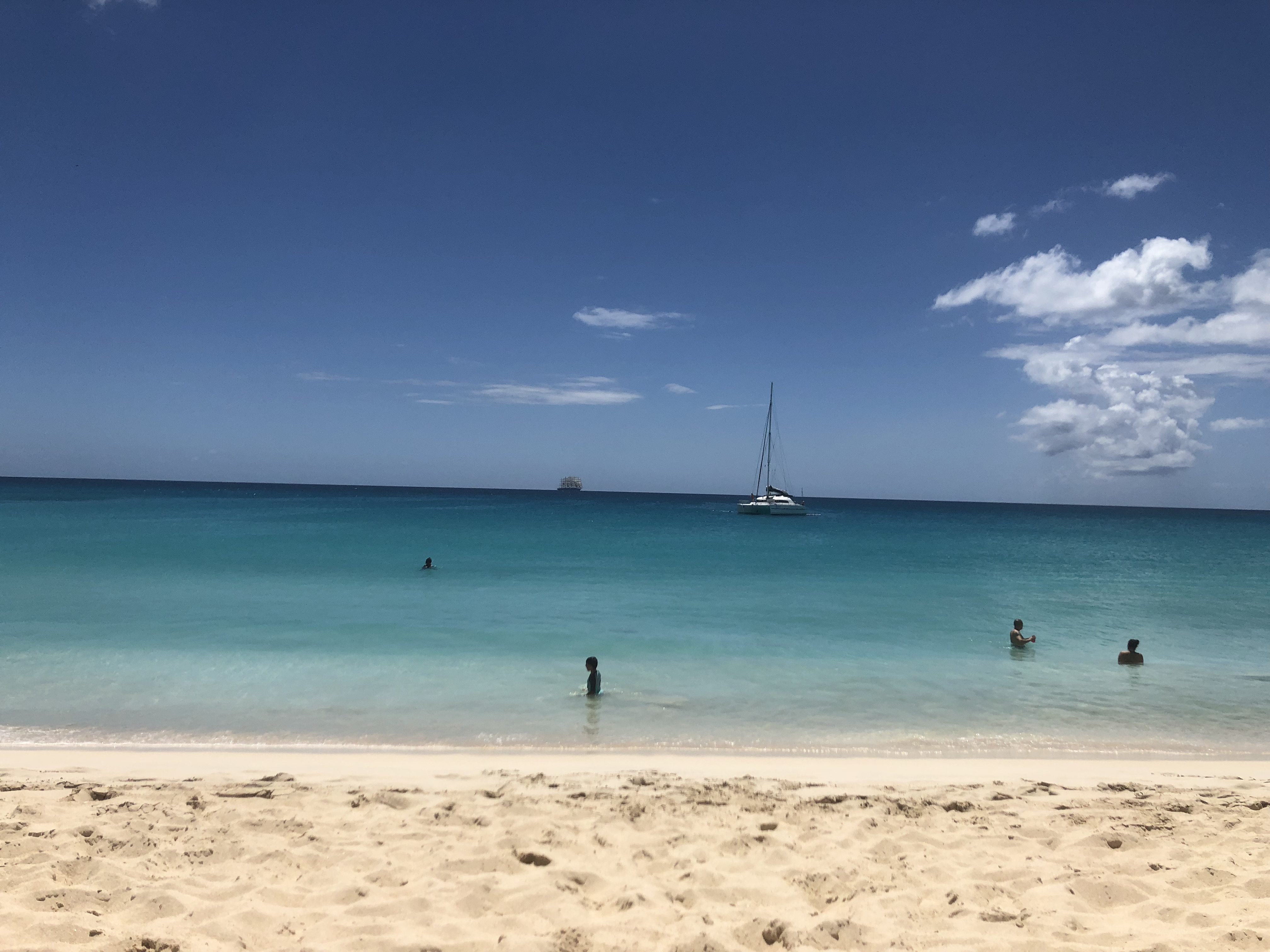 The calm sea at Mullet Bay Beach for swimming in St. Maarten with kids.