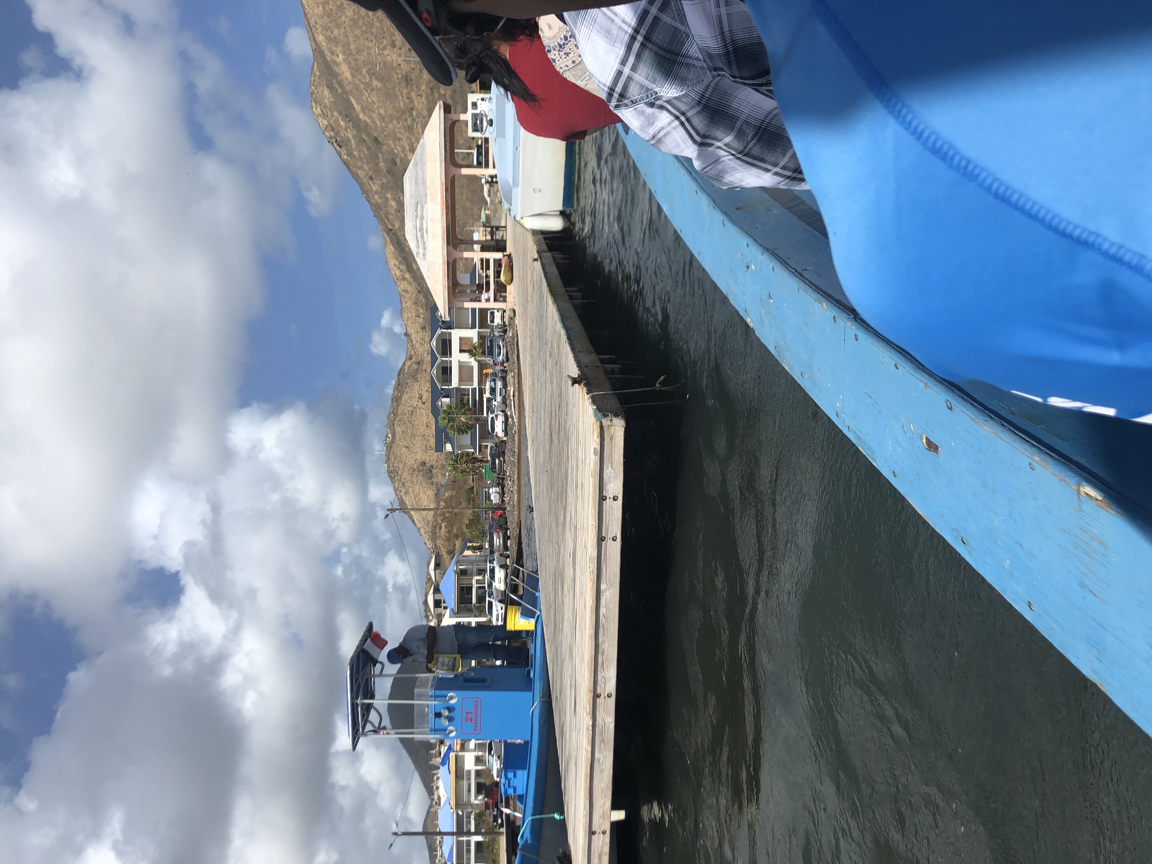 People on ferry leaving dock in St. Martin.