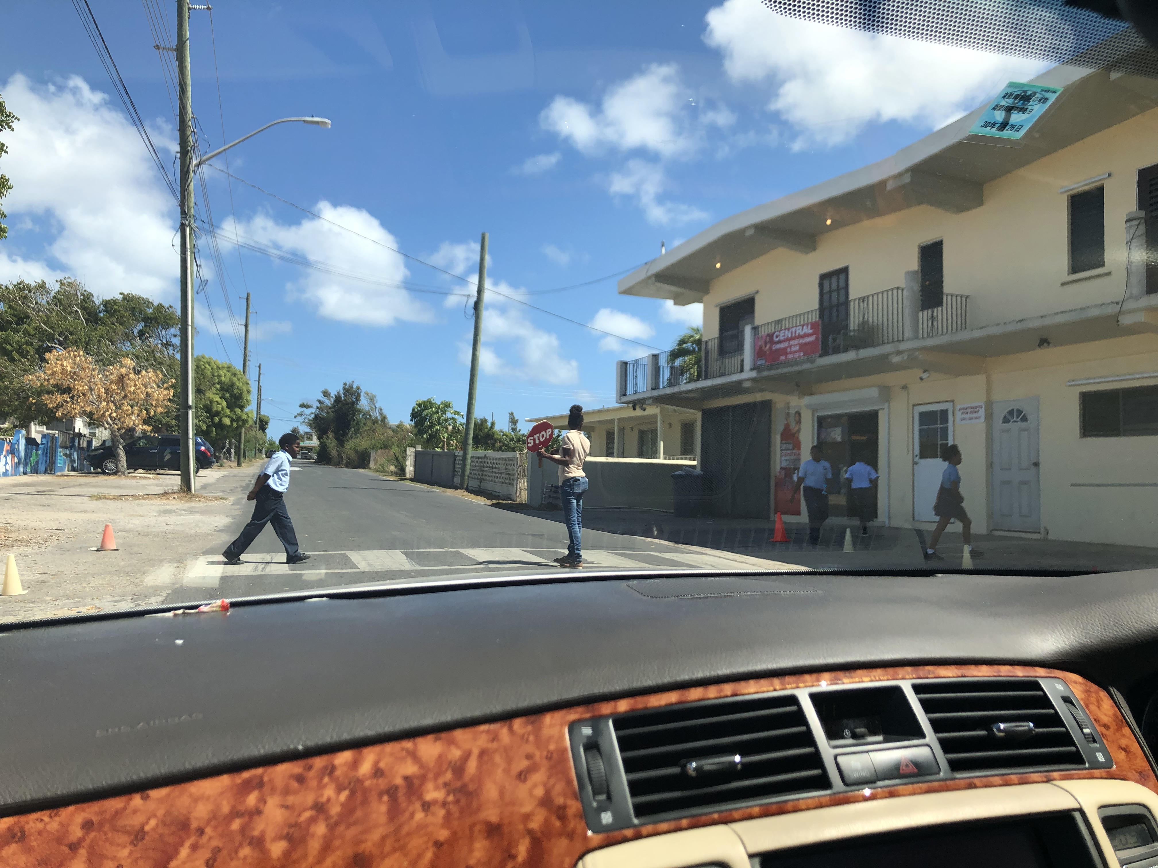 Children crossing the street at a school in Anguilla.
