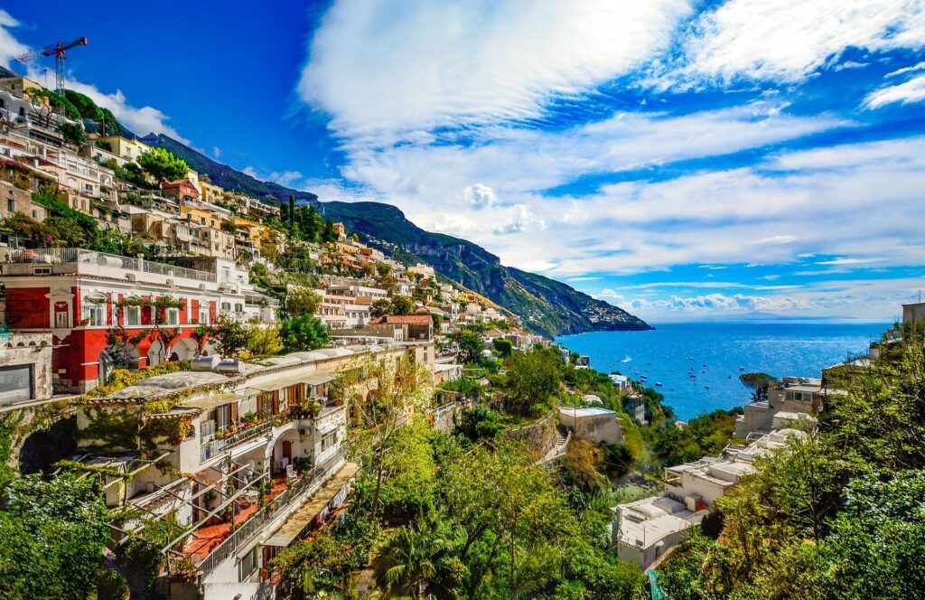 Buildings on a hill overlooking the Amalfi coast, a travel bucket list must.