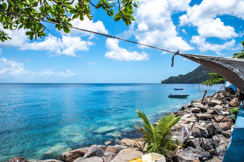 Blue water along a rocky shoreline in St. Vincent and the Grenadines.