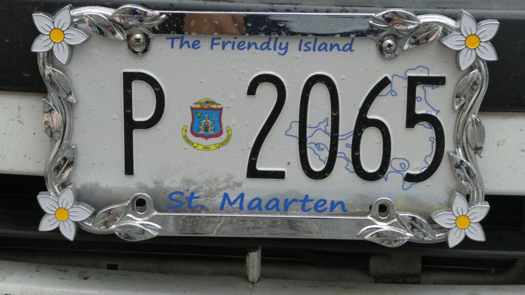 License plate with white background and blue and black text for St Maarten.