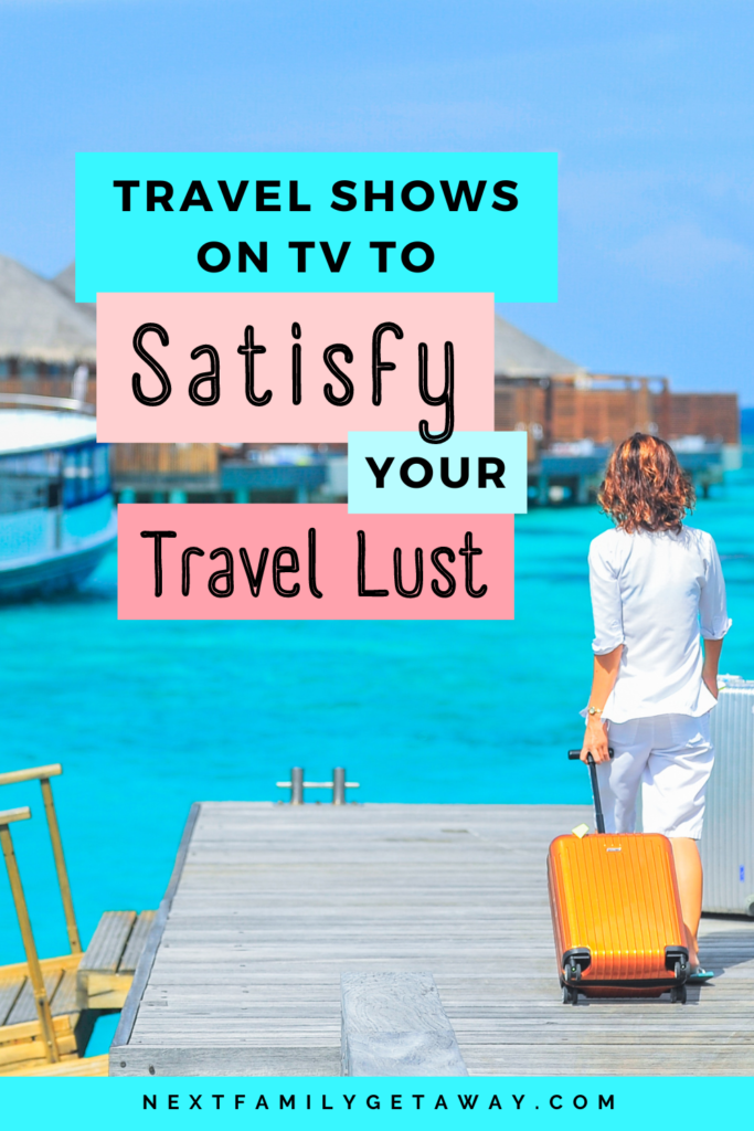 Woman rolling suitcase down dock towards bright blue sea.