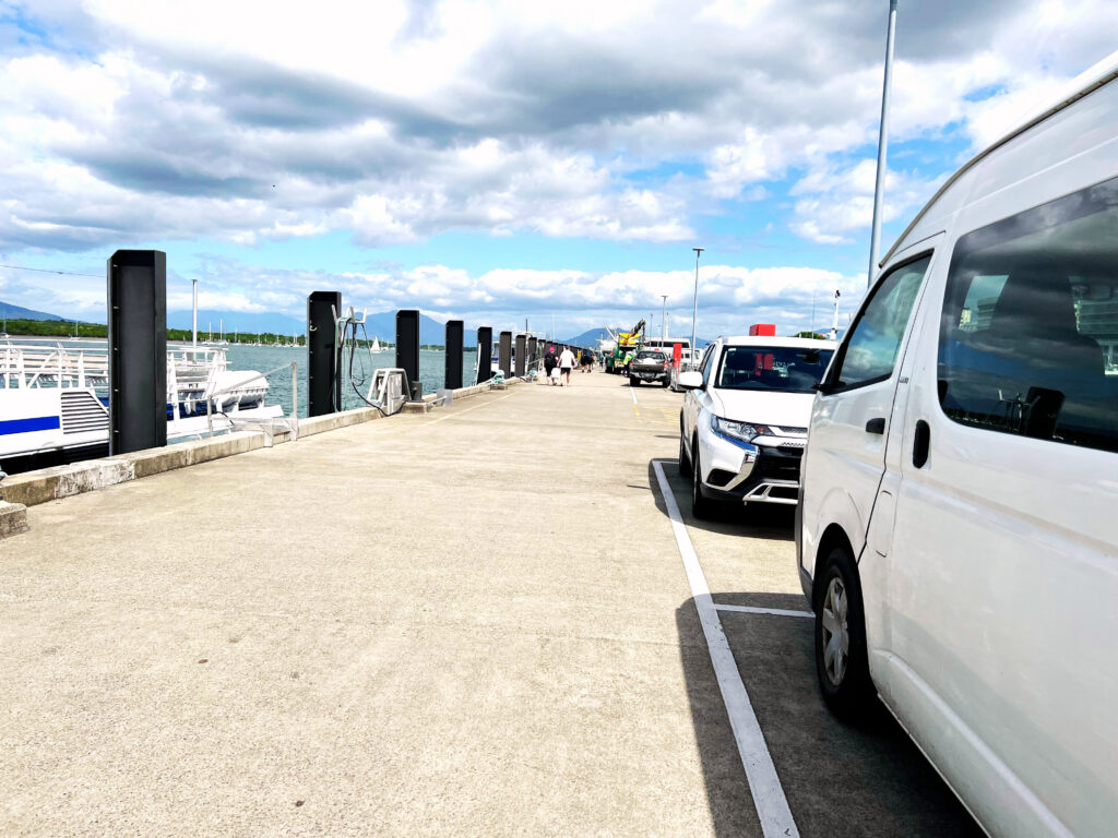 Wide cement jetty stretching a long ways ahead.