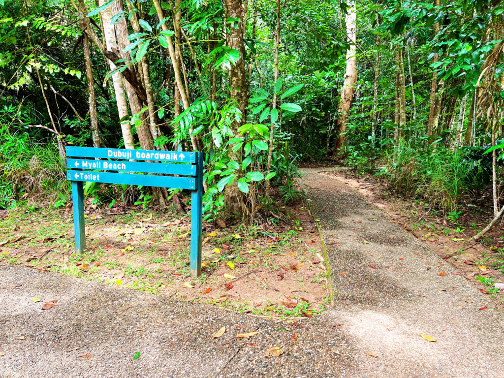 Sign indicating entrance to Dubuji boardwalk in rainforest.