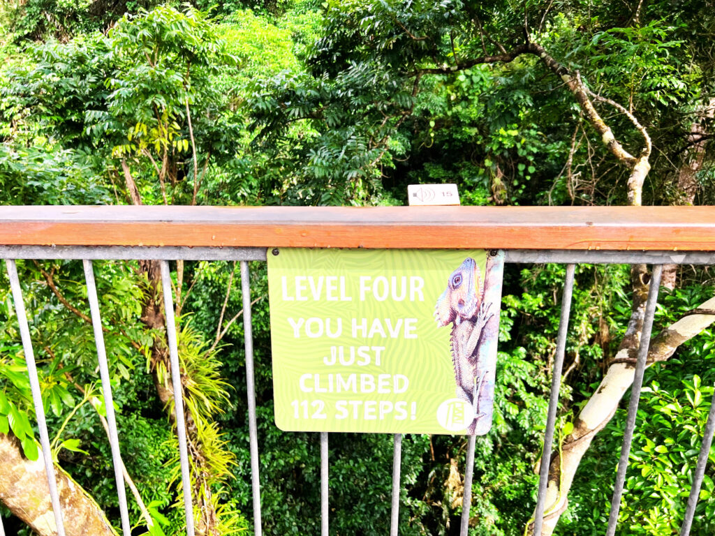 Sign attached to railing stating you have just climbed 112 steps.