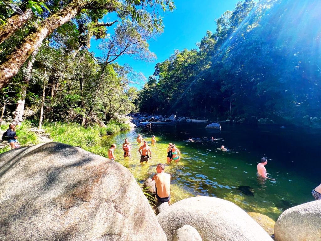 People swimming in the water at Mossman Gorge.