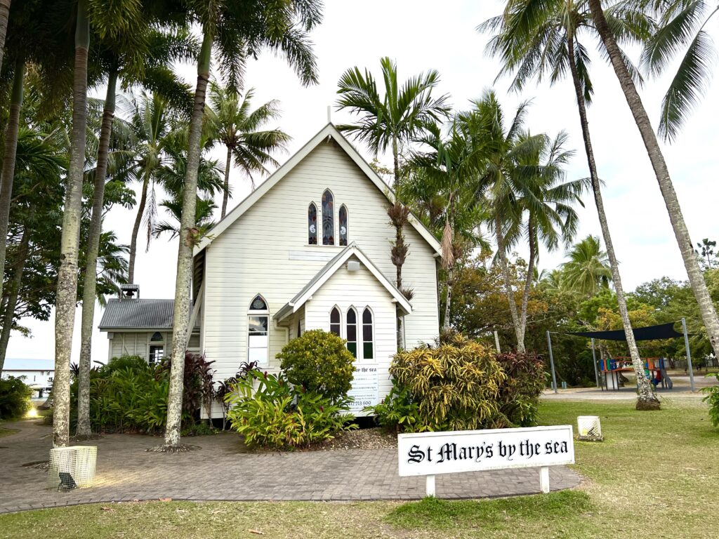 White chapel sitting amongst palm trees in Port Douglas that a tourist may visit during 5 days in Tropical North Queensland.