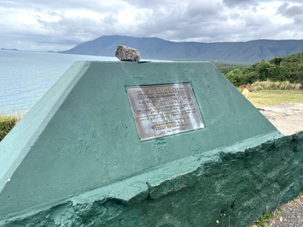 Rock memorial sign for Rex Lookout on beach, a short stop on your 5 days in Tropical North Queensland trip.