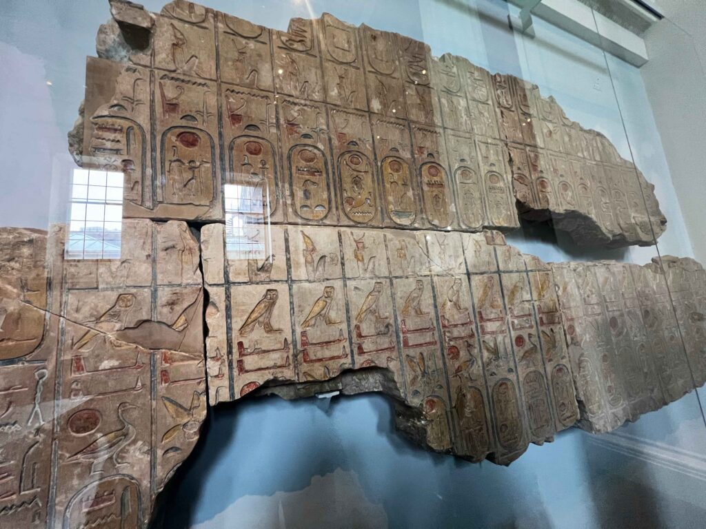 A display case housing Egyptian hieroglyphs in the British Museum.