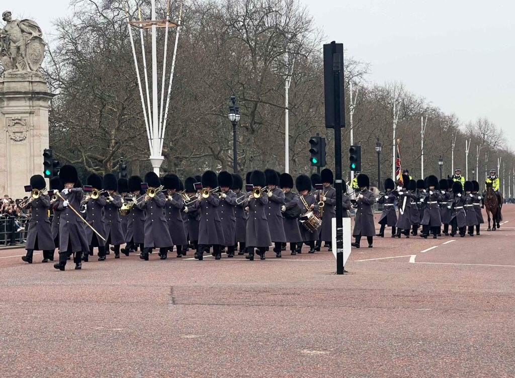Soldiers marching down The Mall to Buckingham Palace, something not to be missed in London with teens.