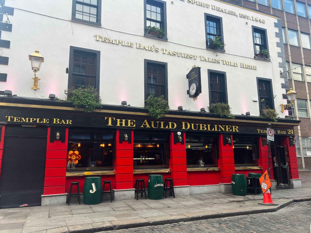 White, black and red building housing a bar in Dublin.