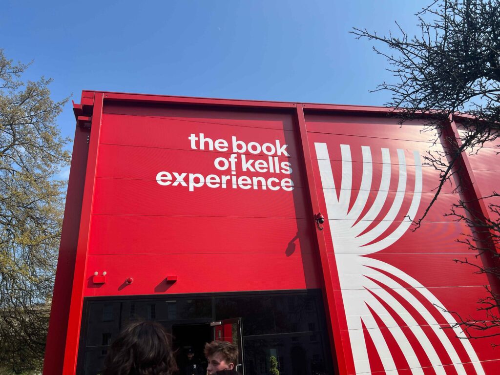 A red building inside of which is the Book of Kells Experience.