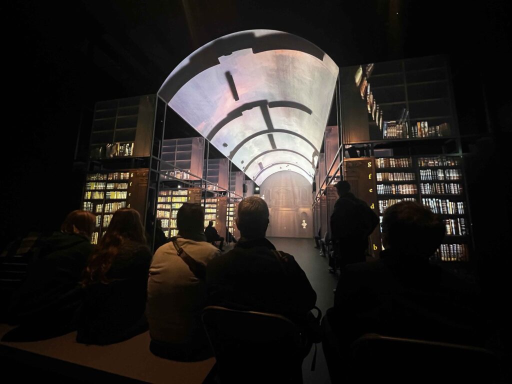 A digital display recreating a library.