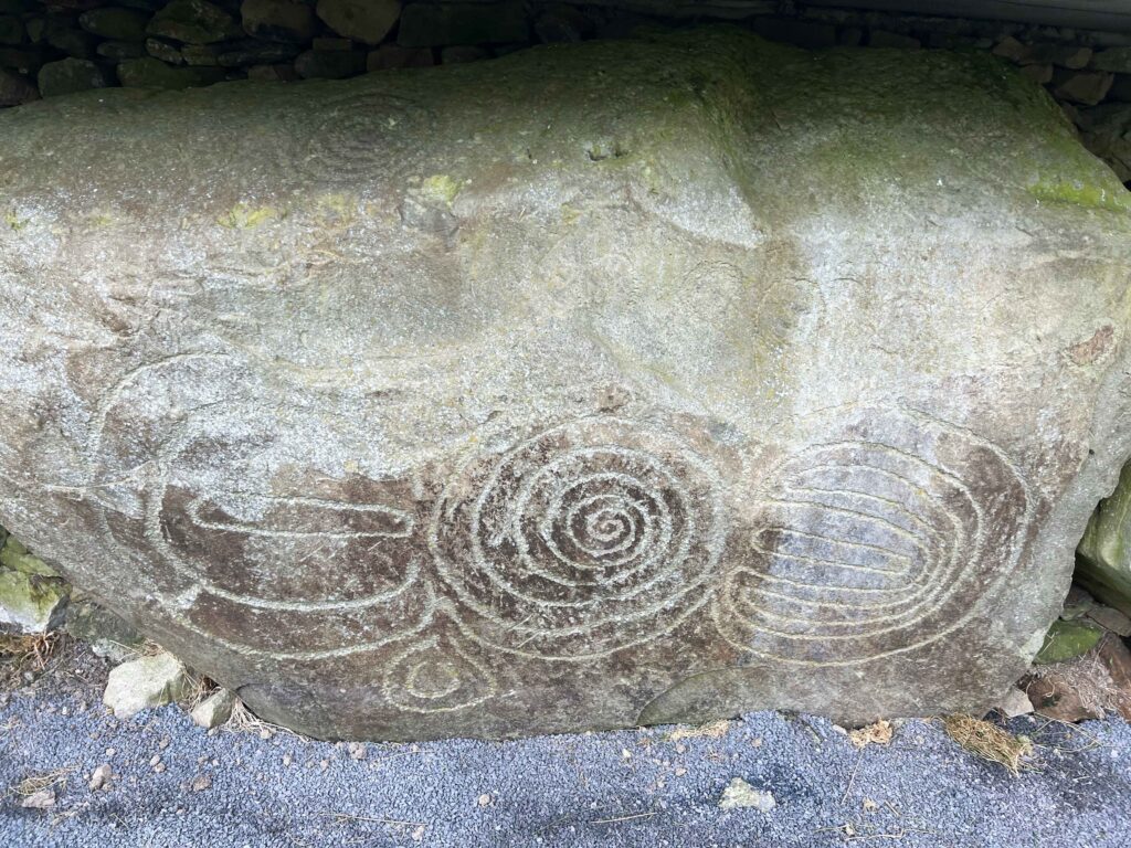 Carvings in a stone boulder.