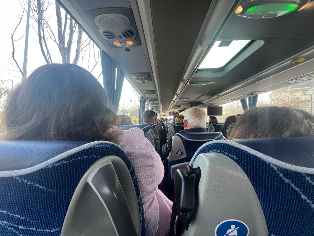 People sitting inside a commuter bus.