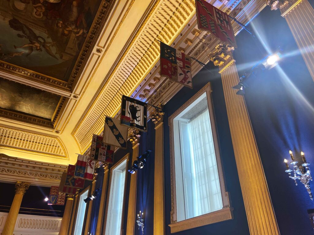 Detailed and ornate flags hung within the Dublin Castle that you must see on a stopover in Ireland.