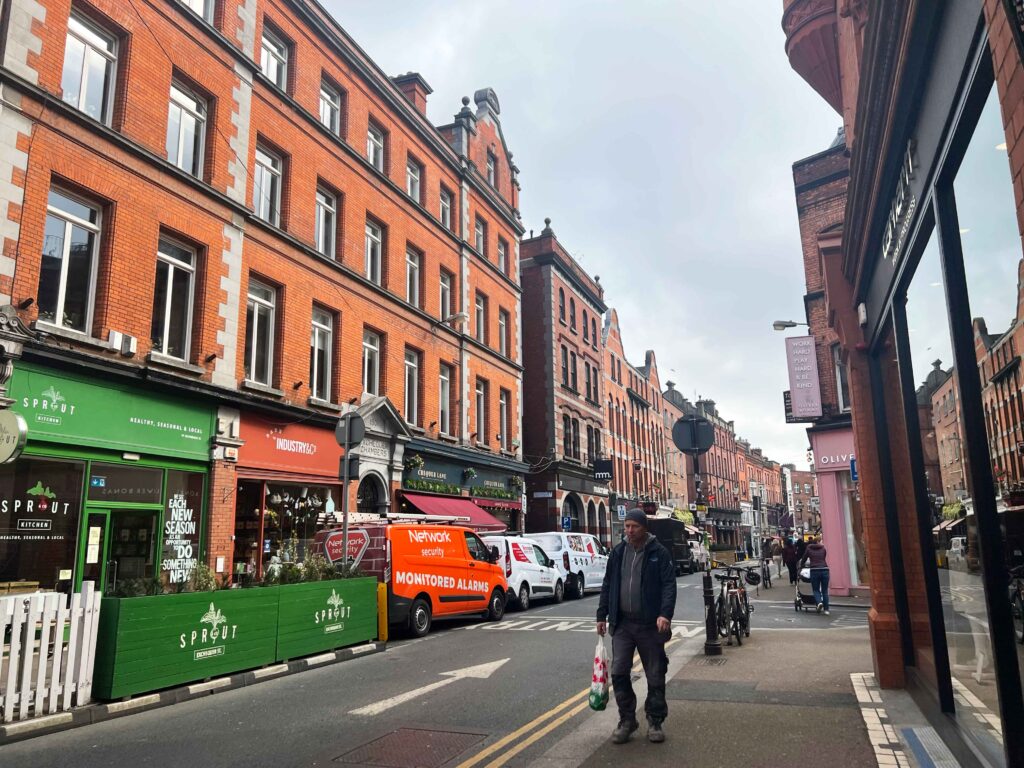 Picturesque red brick building on a street in Dublin.