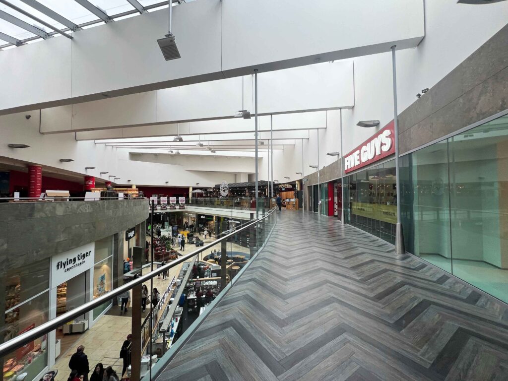 Shops inside a mall you may visit on a stopover in Ireland.