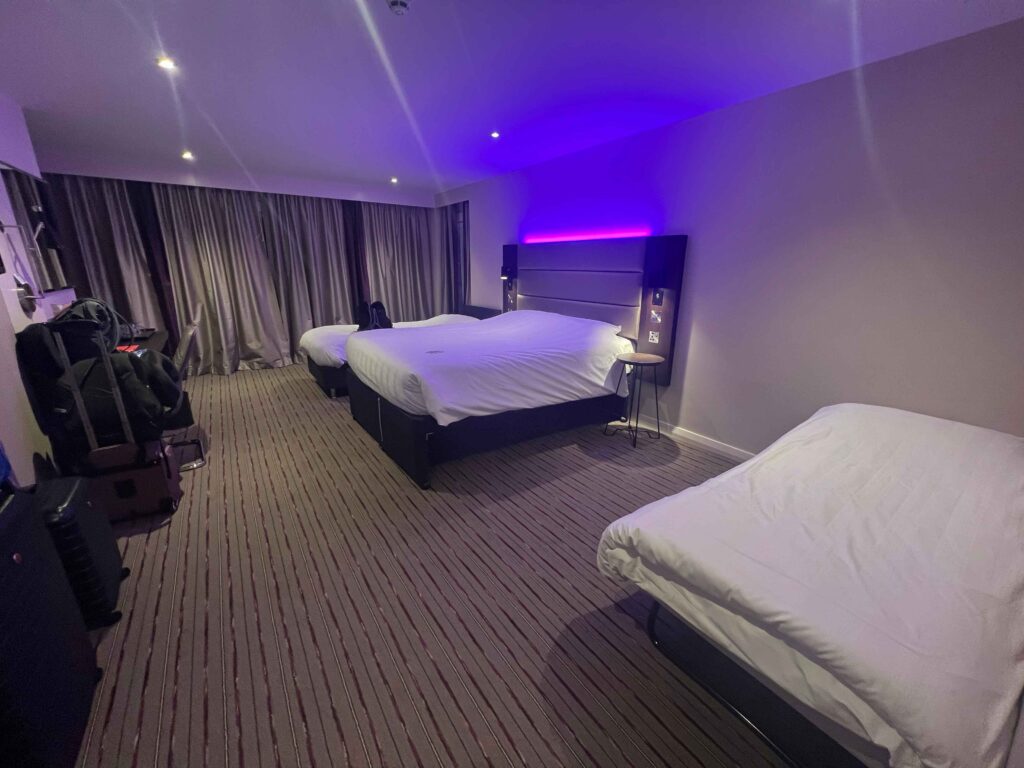 Four beds in a hotel room you could stay at on a stopover in Ireland.