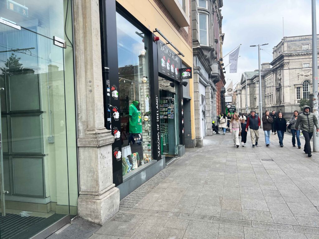 Shops inside old buildings on a Dublin street you may visit on a stopover in Ireland.