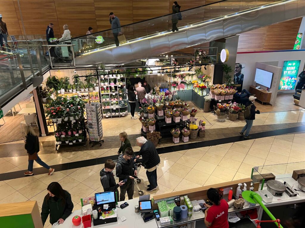 A floral shop inside a shopping mall.