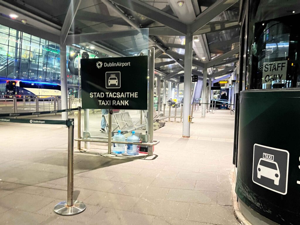Taxi rank stand outside an airport terminal where you can catch a taxi on a stopover in Ireland.